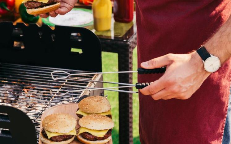Picture of hot dogs and hamburgers on a grill